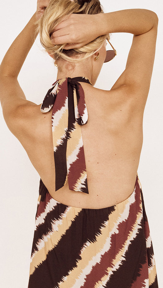 Halter Mini Dress in Abstract Stripe featuring open back and halter neckline detail.