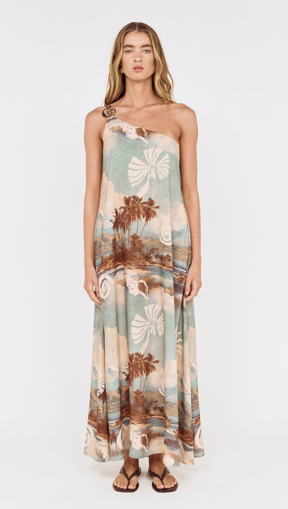 Model wearing Island Print One Shoulder Maxi Dress with scenic seaside print and relaxed silhouette.