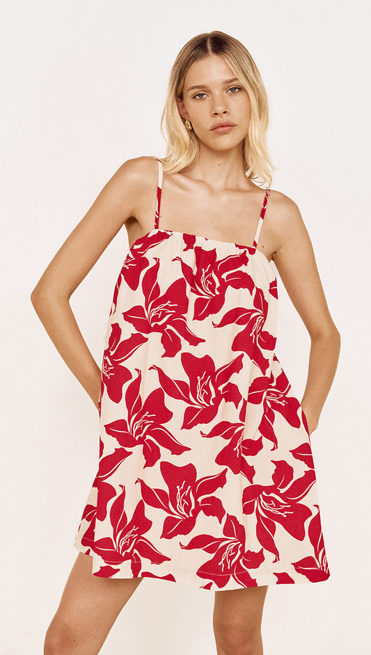 Cotton A-Line Mini Dress in Red Floral featuring a bold red floral print and adjustable tie shoulder straps.