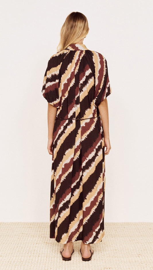 Back view of Puff Sleeve Belted Shirt Dress in Abstract Stripe with diagonal stripes in chocolate and burgundy.