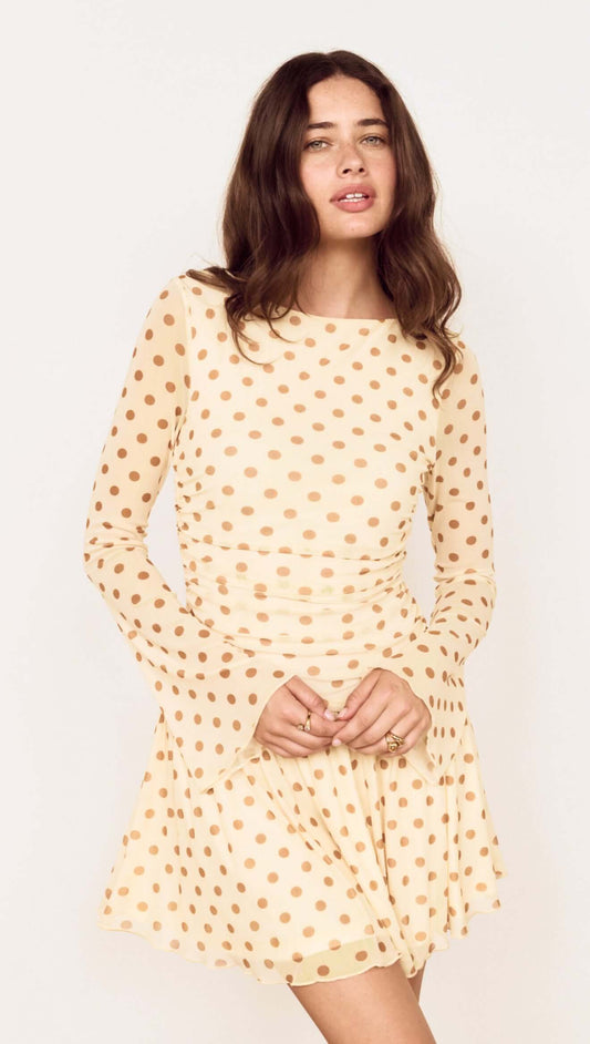 Butter Yellow Polka Dot Mini Dress with Drop Waist, showcasing a playful design and flattering silhouette.