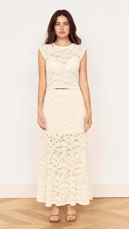 Woman wearing a Cream Cotton Lace Maxi Skirt paired with a matching lace top, showcasing a romantic, elegant style.