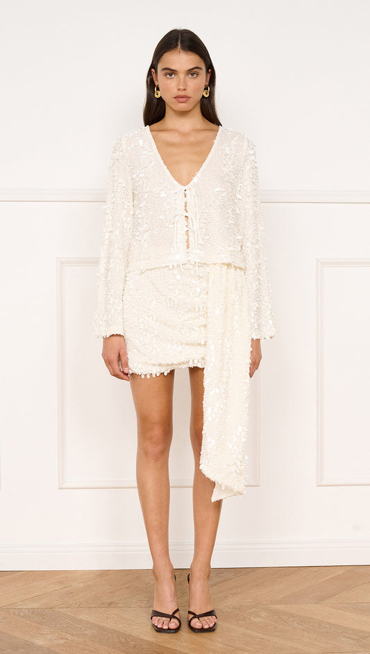 Model wearing Sash Detail Sequin Mini Skirt in Cream with a matching sequin top.
