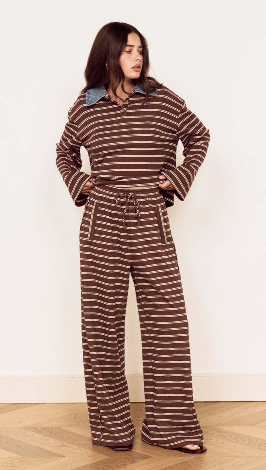 Model wearing Stripe Relaxed Drawstring Jersey Pant with vintage chocolate stripes and a relaxed fit.