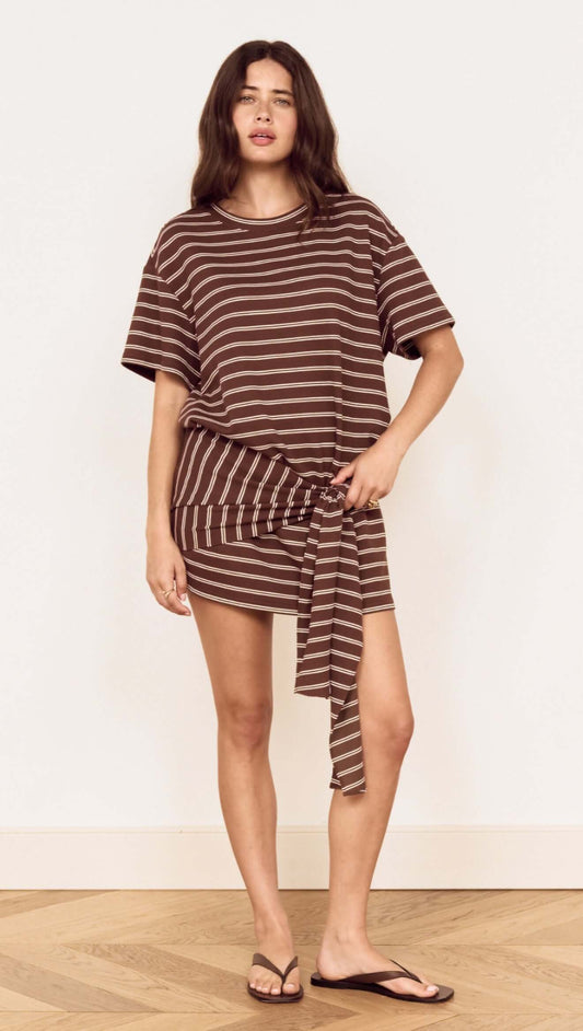 Model wearing Striped Tie Waist Jersey Mini Dress with chocolate stripes and an adjustable tie at the waist.