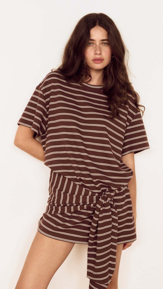 Model wearing Striped Tie Waist Jersey Mini Dress in chocolate stripe print, featuring an oversized tee bodice and fitted mini skirt.