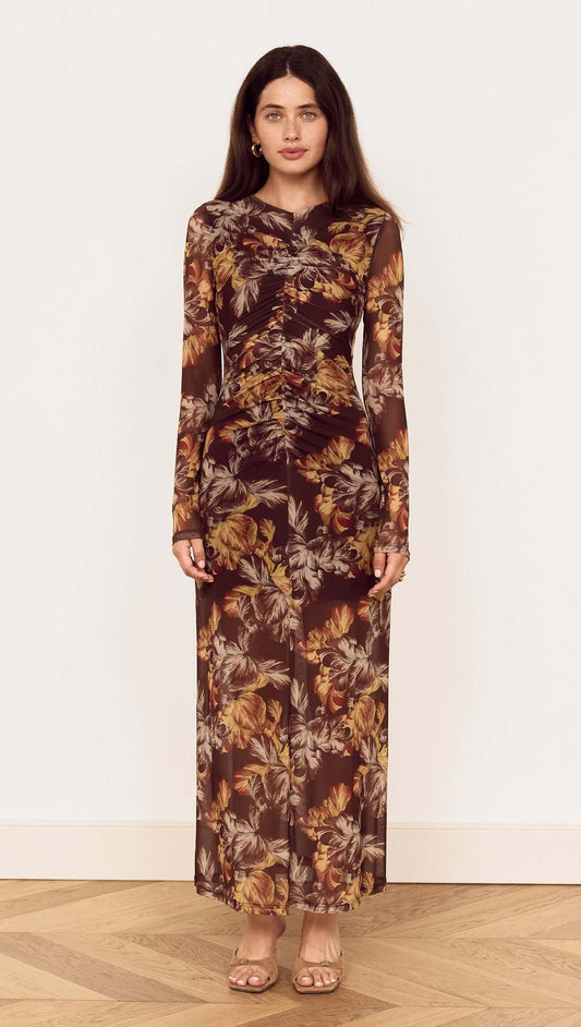Brown Floral Gathered Mesh Midi Dress on a model, featuring a sheer floral print with long sleeves and a fitted silhouette.