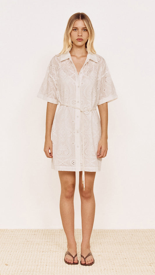 Cotton Broderie Mini Shirtdress in White worn by a model featuring short sleeves and a tie belt.