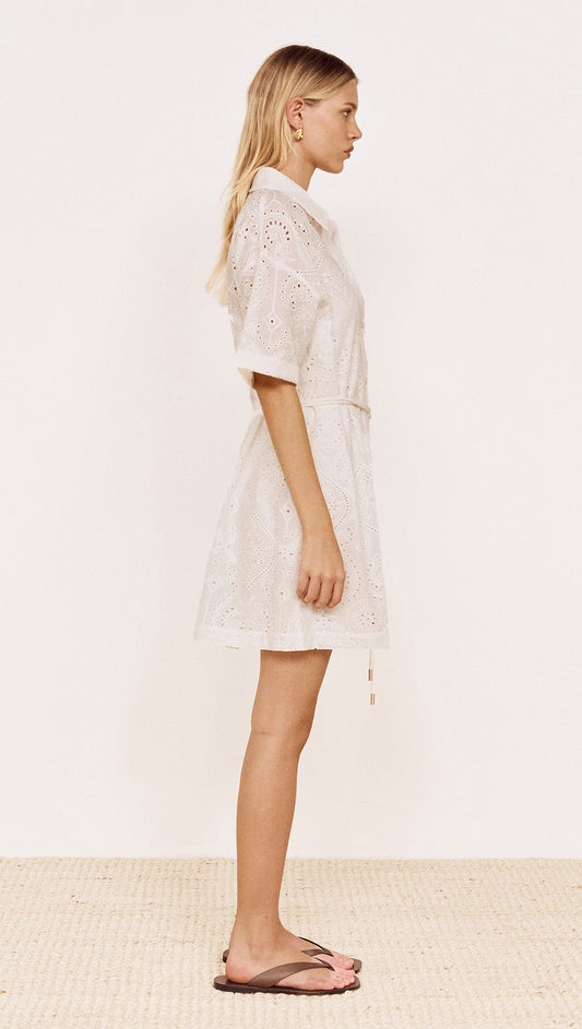 Cotton Broderie Mini Shirtdress in White displayed on a model, featuring a side view with relaxed fit and short sleeves.