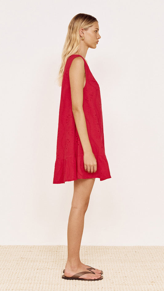 Cotton Broderie Mini Dress in Red displayed on a model, showcasing the V-neckline and frill hem.