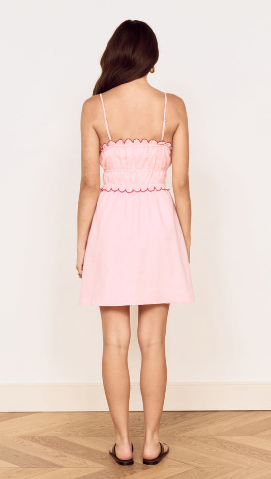 Linen Blend Mini Dress with Scallop Detail in soft pink, featuring a gathered bodice and adjustable straps.