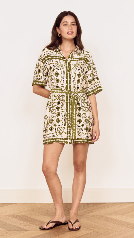 Model wearing a Scarf Print Shirt Dress in Olive, showcasing a floral print and relaxed silhouette.