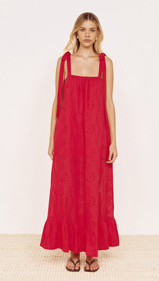 Cotton Broderie Maxi Sun Dress in Red worn by a model showcasing its relaxed silhouette and tie shoulder straps.