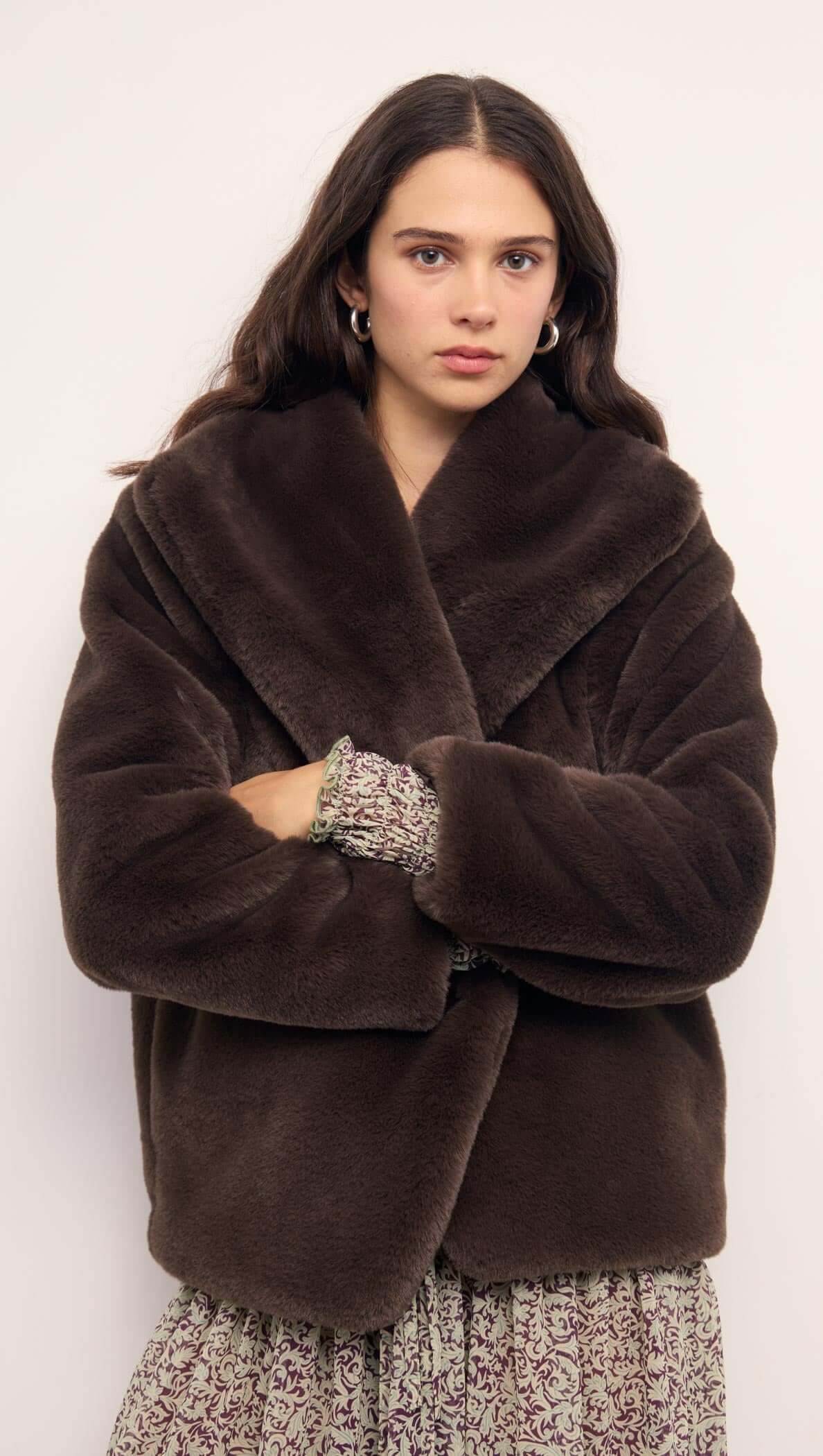 Model wearing a stylish Brown Faux Fur Coat with an oversized collar for a chic winter look.