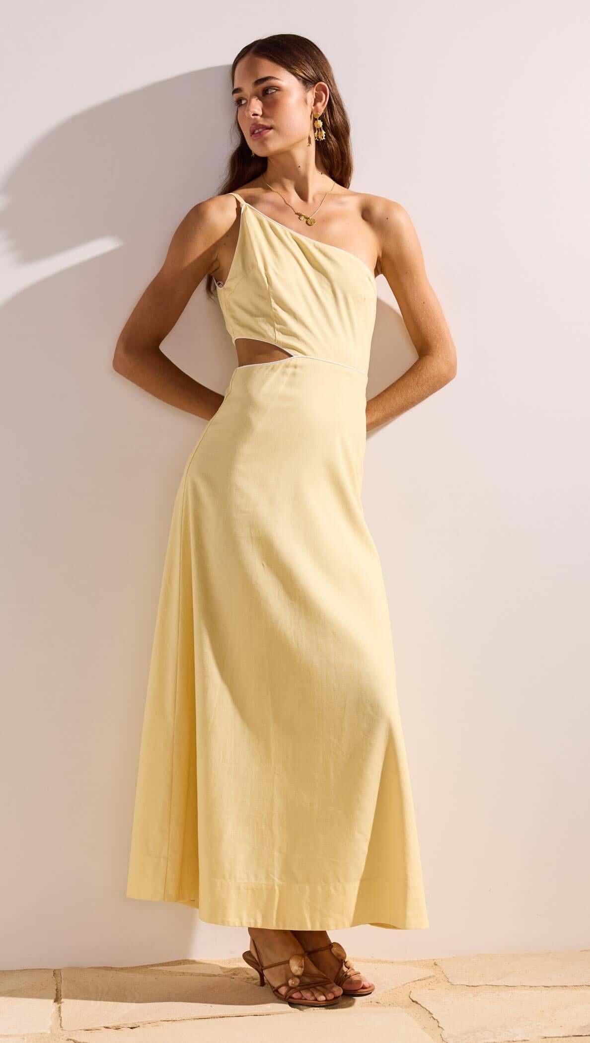 Butter Yellow Asymmetric Cut Out Maxi Dress featuring a one-shoulder neckline and subtle waist cut-out