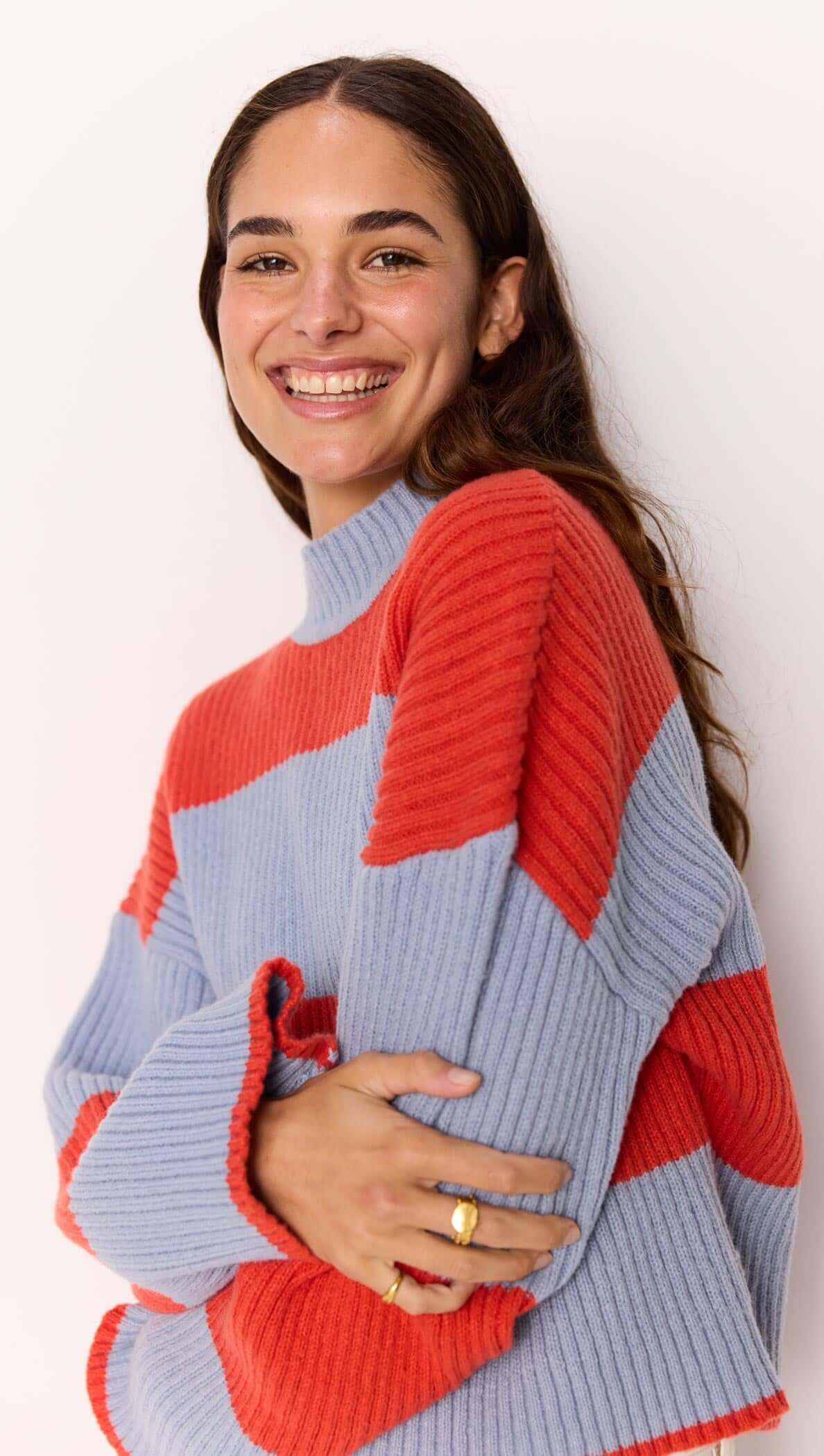 Freja Stripe Chunky Knit in bold red and blue stripes, featuring a relaxed fit and flared sleeves by MINKPINK.