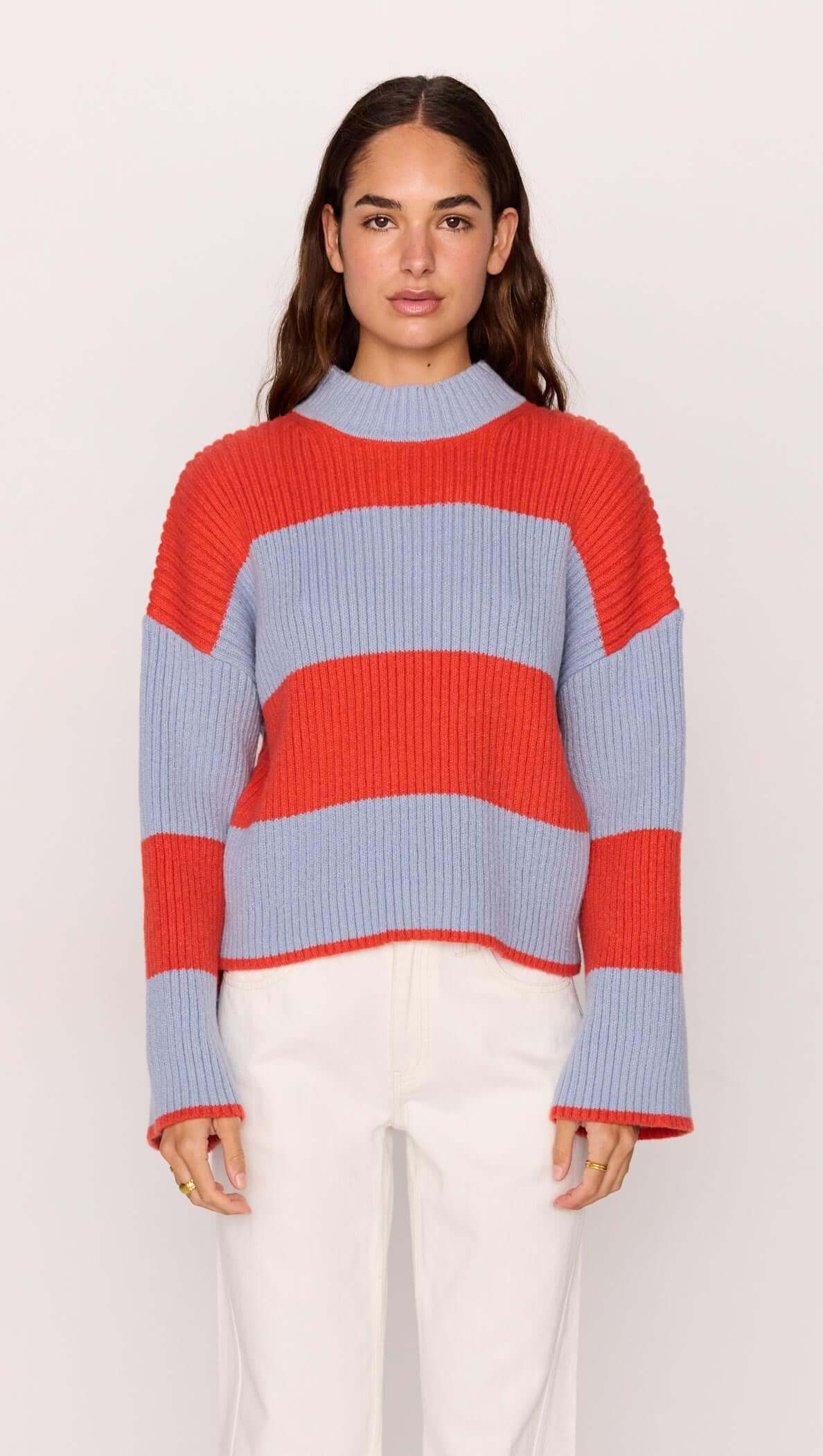 Freja Stripe Chunky Knit in bold red and blue stripes, featuring a relaxed fit and flared sleeves by MINKPINK.