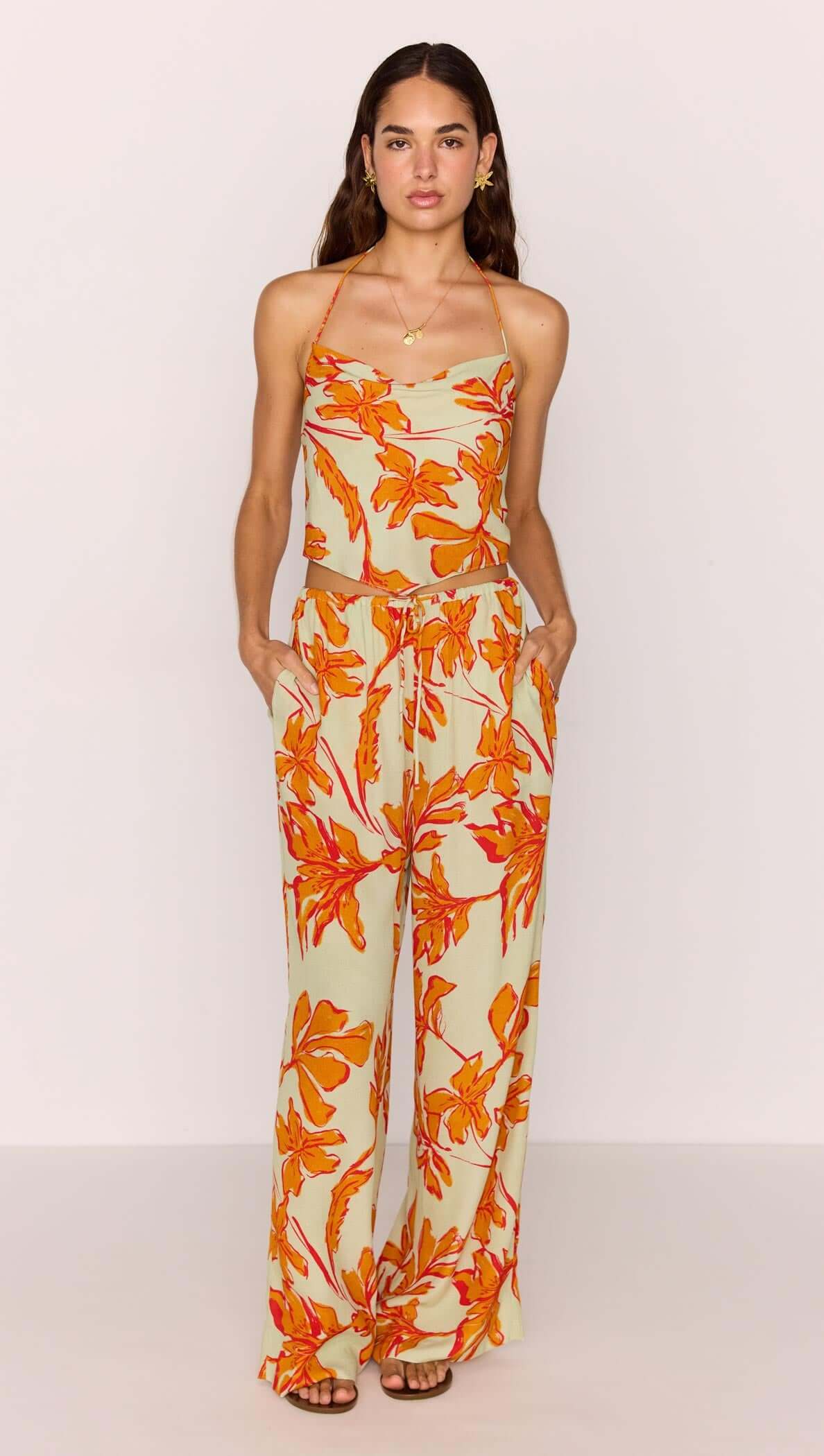 Green & Orange Floral Drawstring Wide Leg Pant worn by model with floral patterns in orange and green.