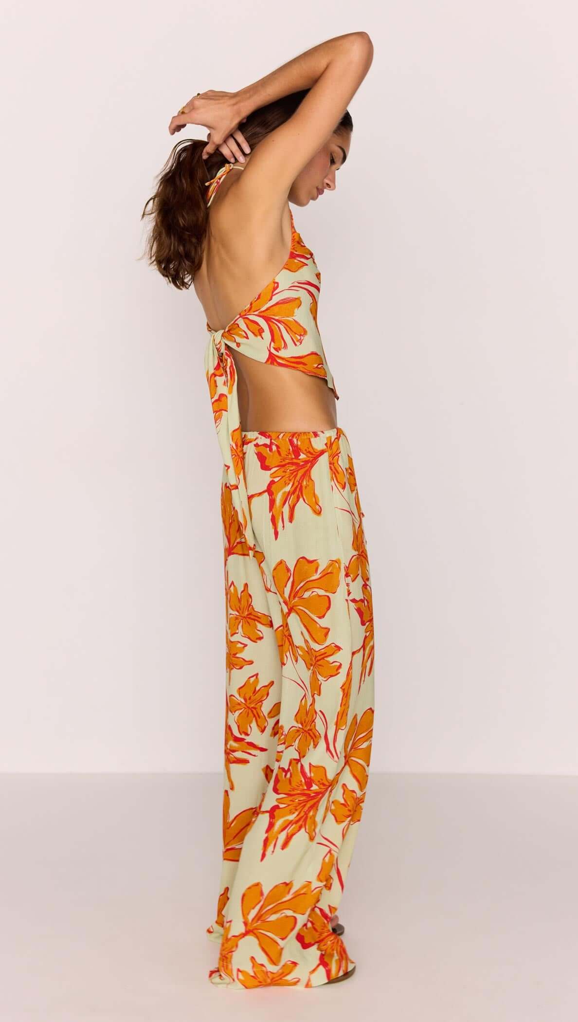 Green & Orange Floral Drawstring Wide Leg Pant styled with a matching top, showcasing a relaxed fit and vibrant print.