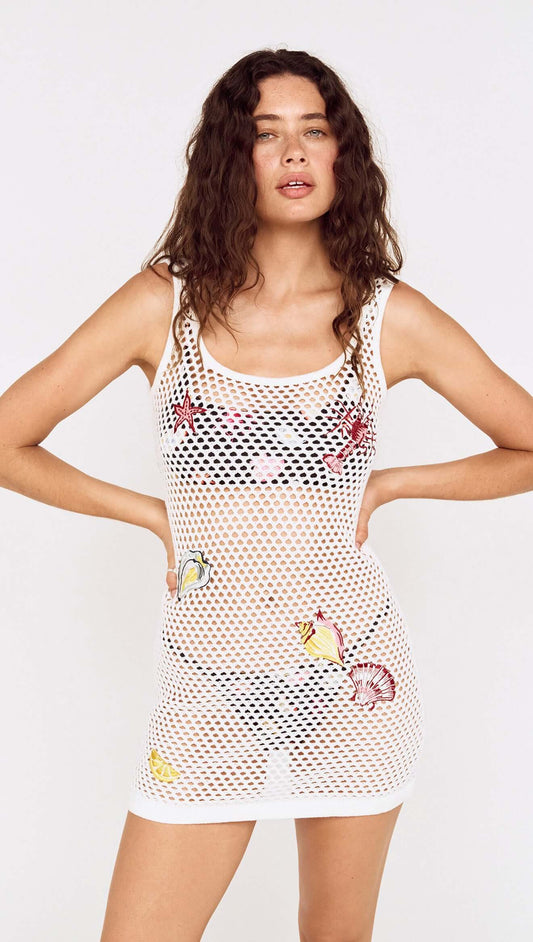 White Crochet Mini Dress with Embroidered Shellfish worn by a model showcasing unique shellfish designs.