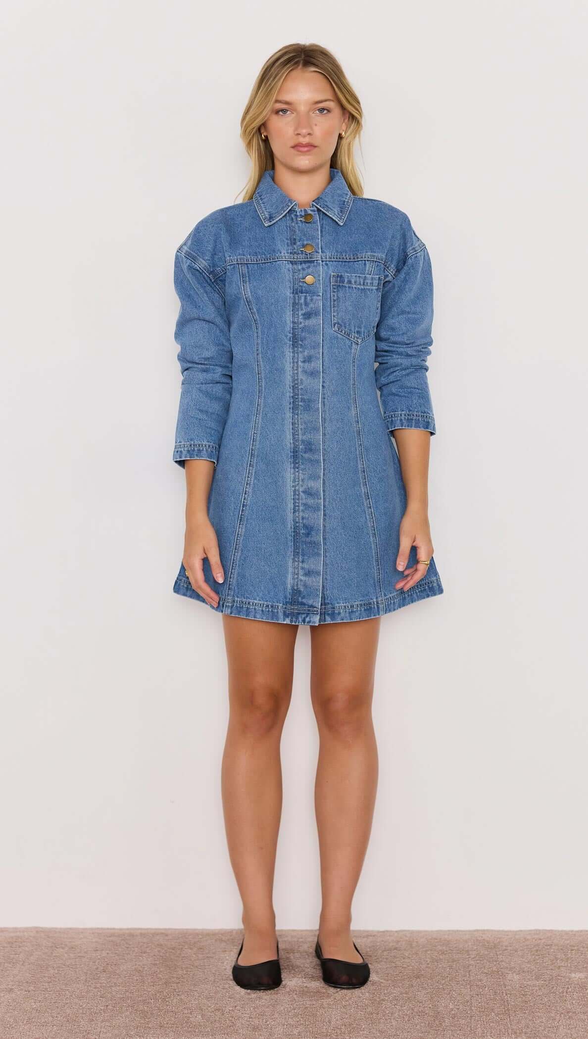 Tully Denim Mini Dress in vintage blue with long sleeves, collared neckline, and front snap button closure.