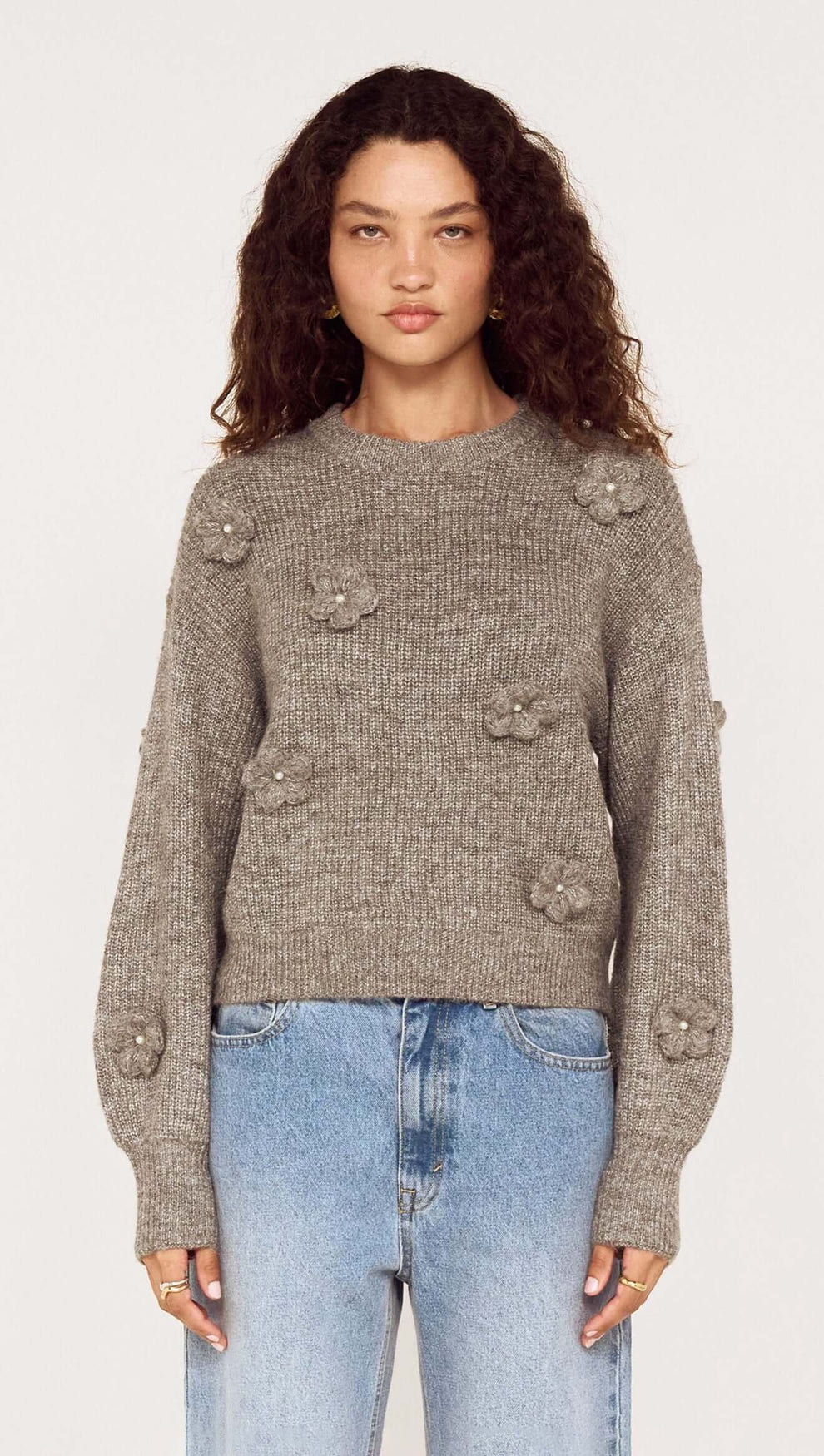 Round Neck Grey Floral Applique Jumper featuring floral appliqué and pearl accents, styled with denim.