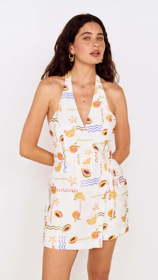 Fruit Print Halter Neck Romper featuring a vibrant fruit pattern and a flattering halter neckline, perfect for summer outings.