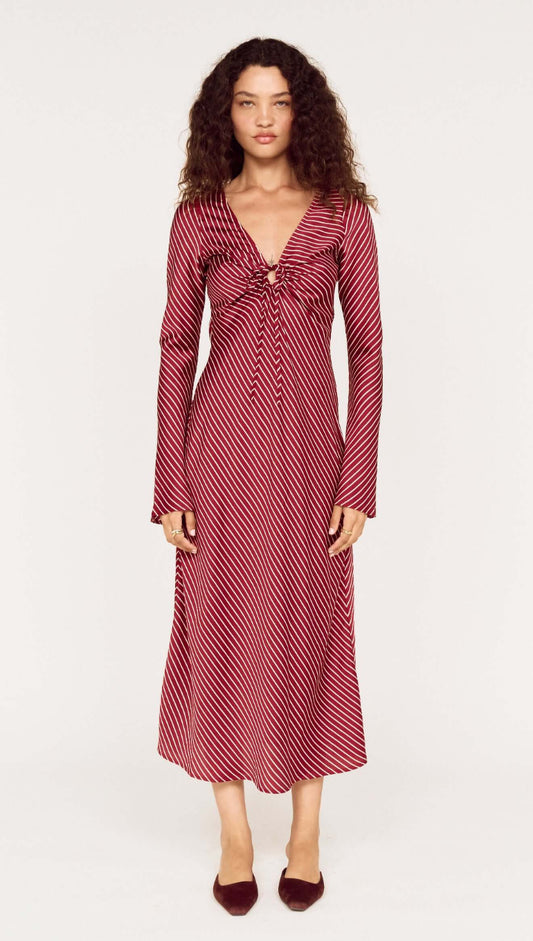 Burgundy Pinstripe Bias Cut Midi Dress worn by a model, featuring a plunging V-neckline and tie-front detailing.