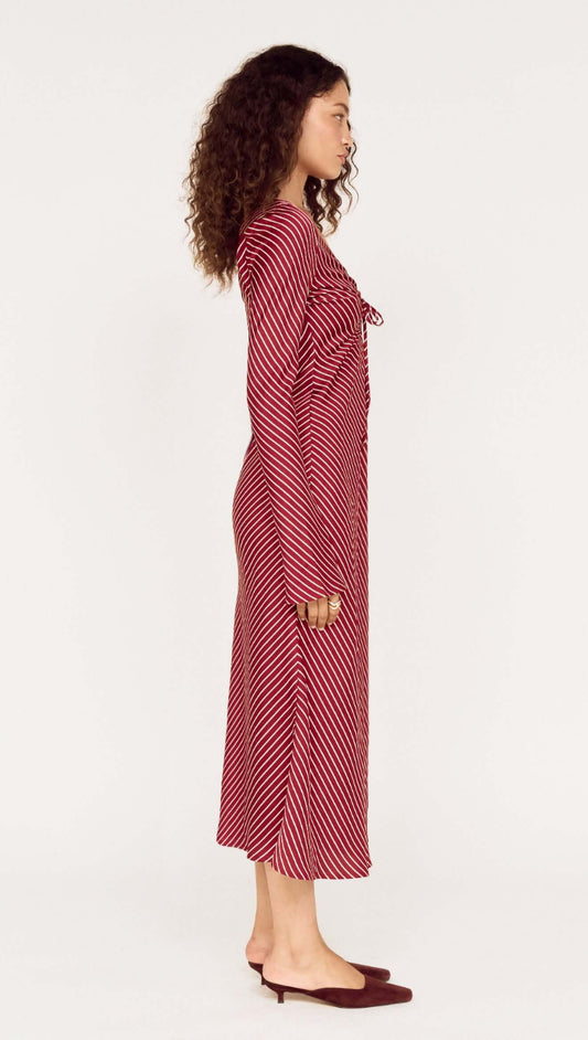Burgundy Pinstripe Bias Cut Midi Dress shown in profile view with tie-front detailing and flared sleeves.