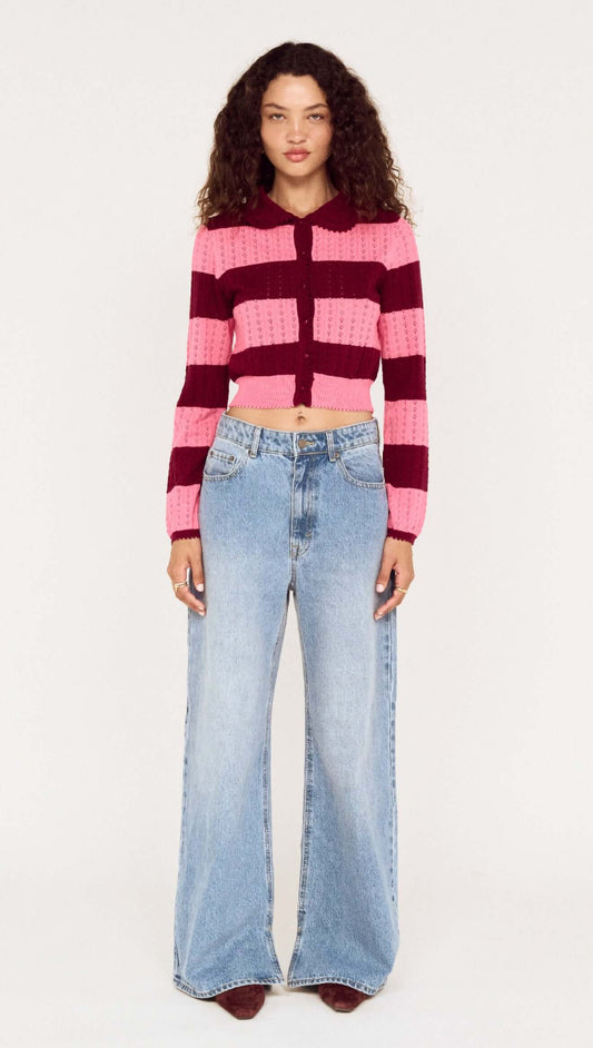 Model wearing a Pink Stripe Pointelle Knit Cardi paired with wide-leg jeans on a neutral background.