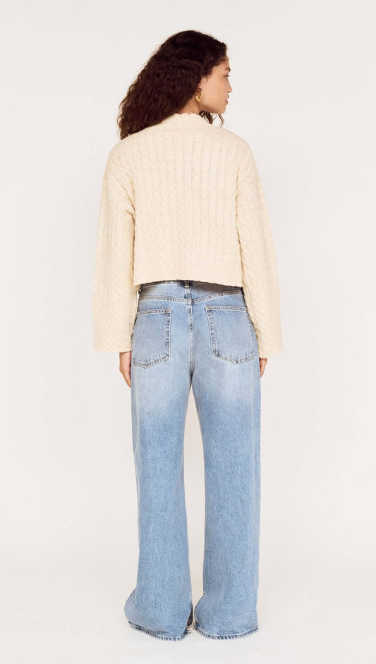 Fine Cable Knit Top with Gold Detail worn with relaxed denim from a rear view.