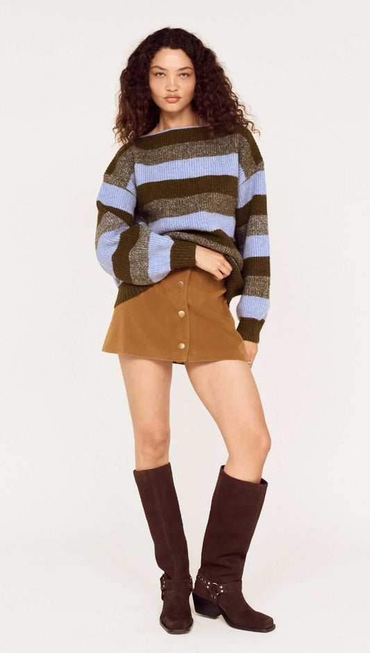 Model wearing a Blue Stripe Soft Boat Neck Jumper paired with a brown skirt and tall boots, showcasing a casual autumn look.