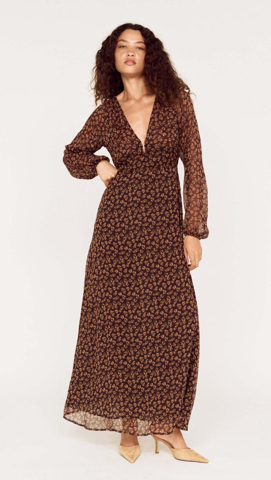 Model wearing a Brown Floral Drape Sleeve Maxi Dress, showcasing elegant design and floral patterns.