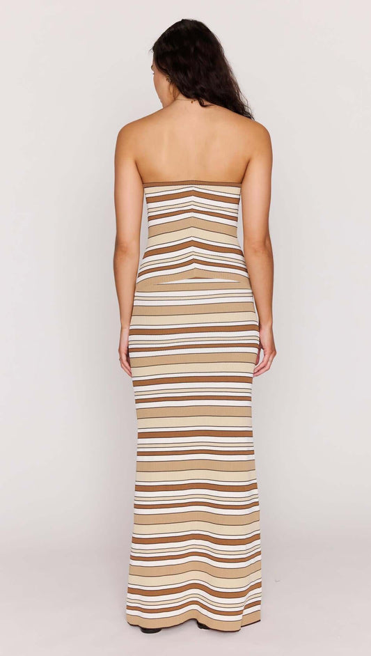 Back view of a model in a Brown Stripe Knit Strapless Midi Dress showcasing its flattering fit and stylish design.