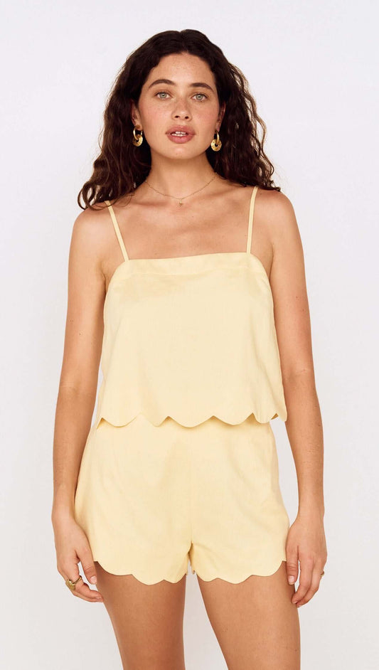 Butter Yellow Cotton Blend Scallop Hem Shorts worn with matching scalloped top on a model.