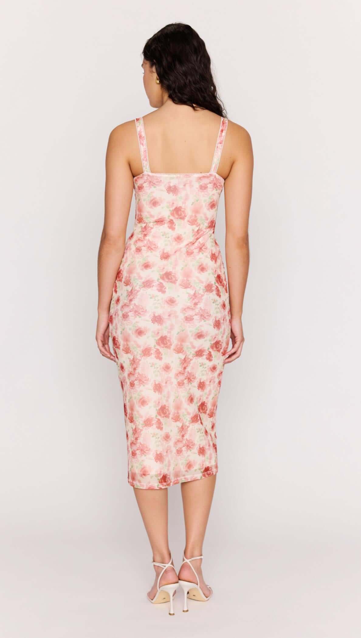 Back view of a woman wearing the Pink Floral Bustier Mesh Midi Dress with floral print.
