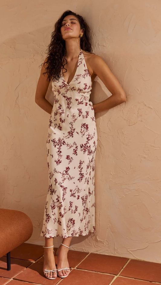 Model wearing Cream Floral Toile Halter Maxi Dress, featuring delicate floral print and plunging neckline.