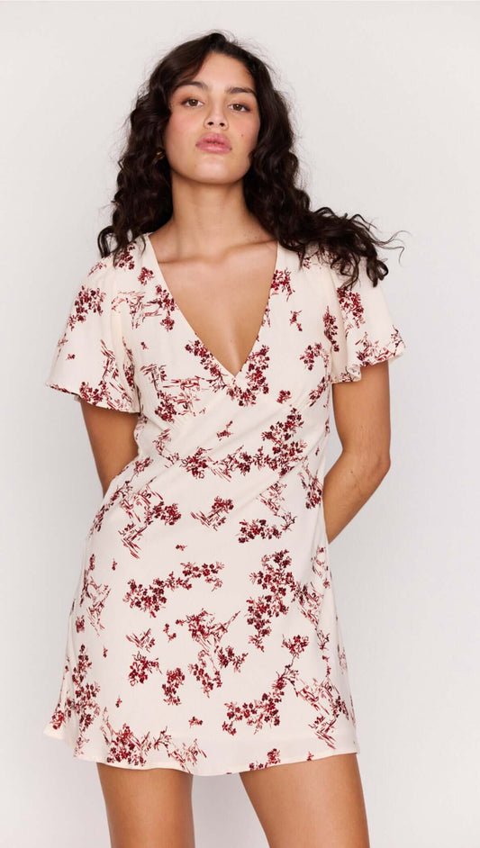 Cream Floral Toile Mini Dress with a plunging V neckline and flutter sleeves in a soft romantic design.