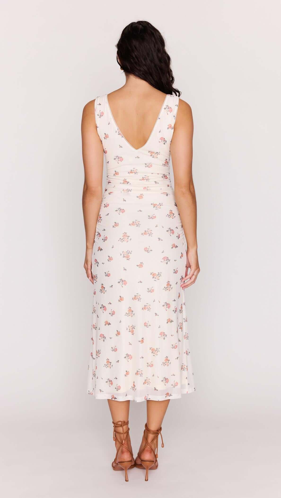 Cream Floral V-Neck Mesh Midi Dress worn from the back, showcasing floral patterns and a flattering V-neckline.