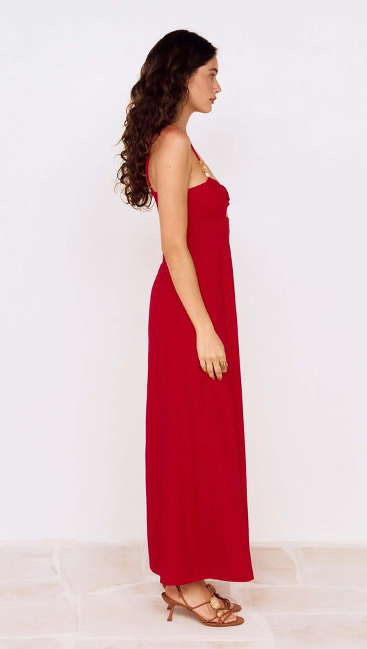 Model wearing a Deep Red Twist Front Maxi Dress in profile view, showcasing the elegant design and flowy silhouette.