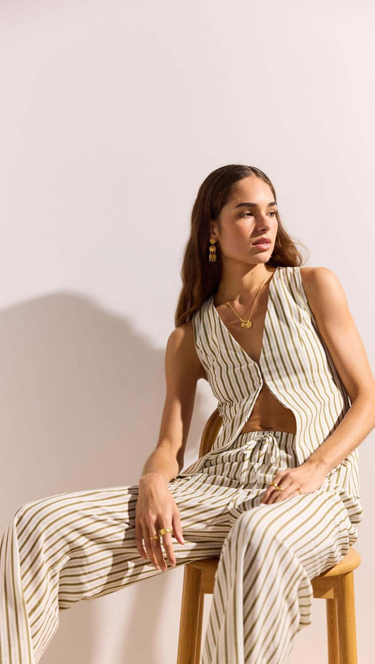 Woman wearing Olive & White Stripe Cotton Blend Vest paired with matching pants, showcasing a relaxed summer style.
