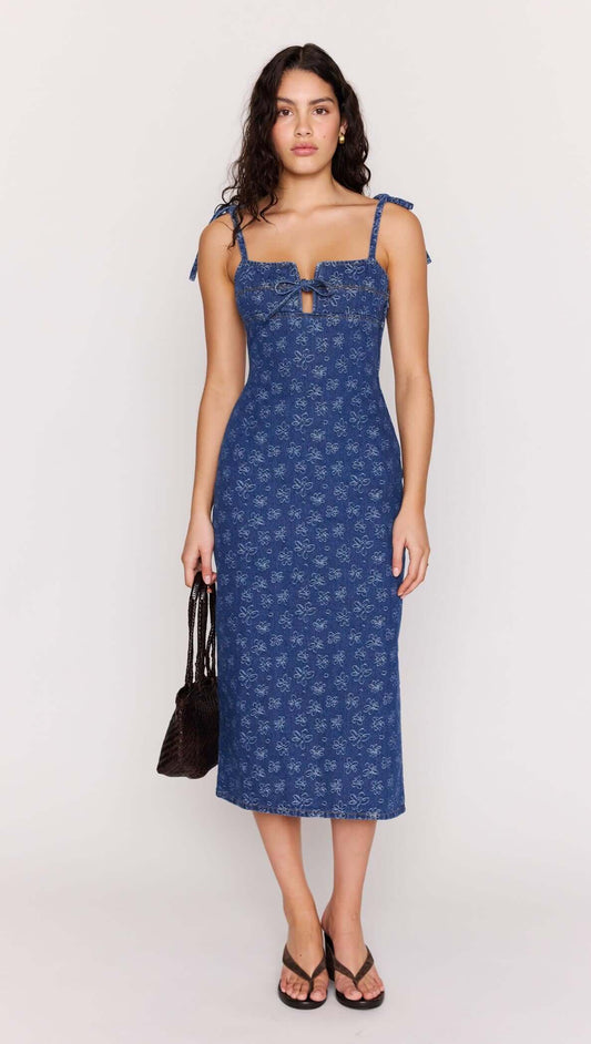 Model wearing the Floral Denim Stretch Midi Dress with a square neckline and floral pattern.