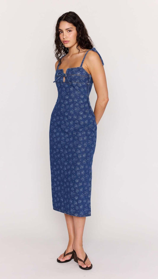 Model wearing Floral Denim Stretch Midi Dress with square neckline and floral pattern, perfect for sunny outings.