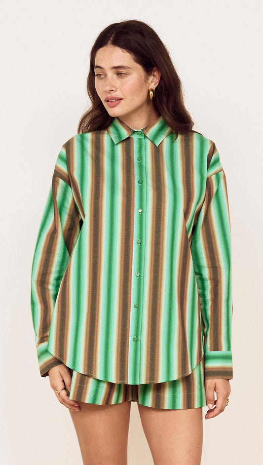A model wearing the Green Stripe Cotton Oversized Shirt, featuring a vibrant painterly stripe print.