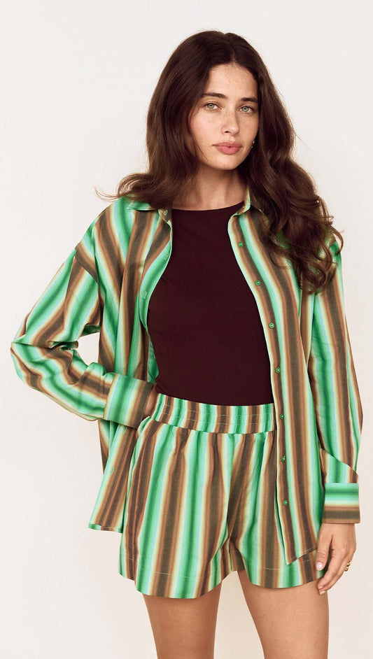 Model showcasing the Green Stripe Cotton Relaxed Short with matching shirt, perfect for summer styling.