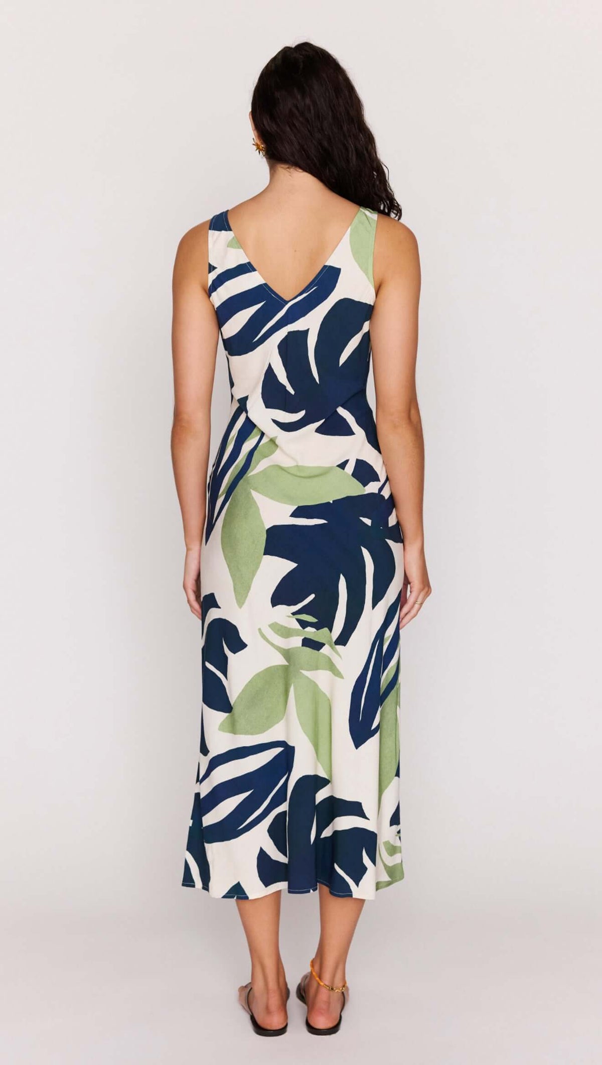 Back view of Leaf Print ECOVERO Tie Front Midi Dress featuring bold botanical print and adjustable tie detail.
