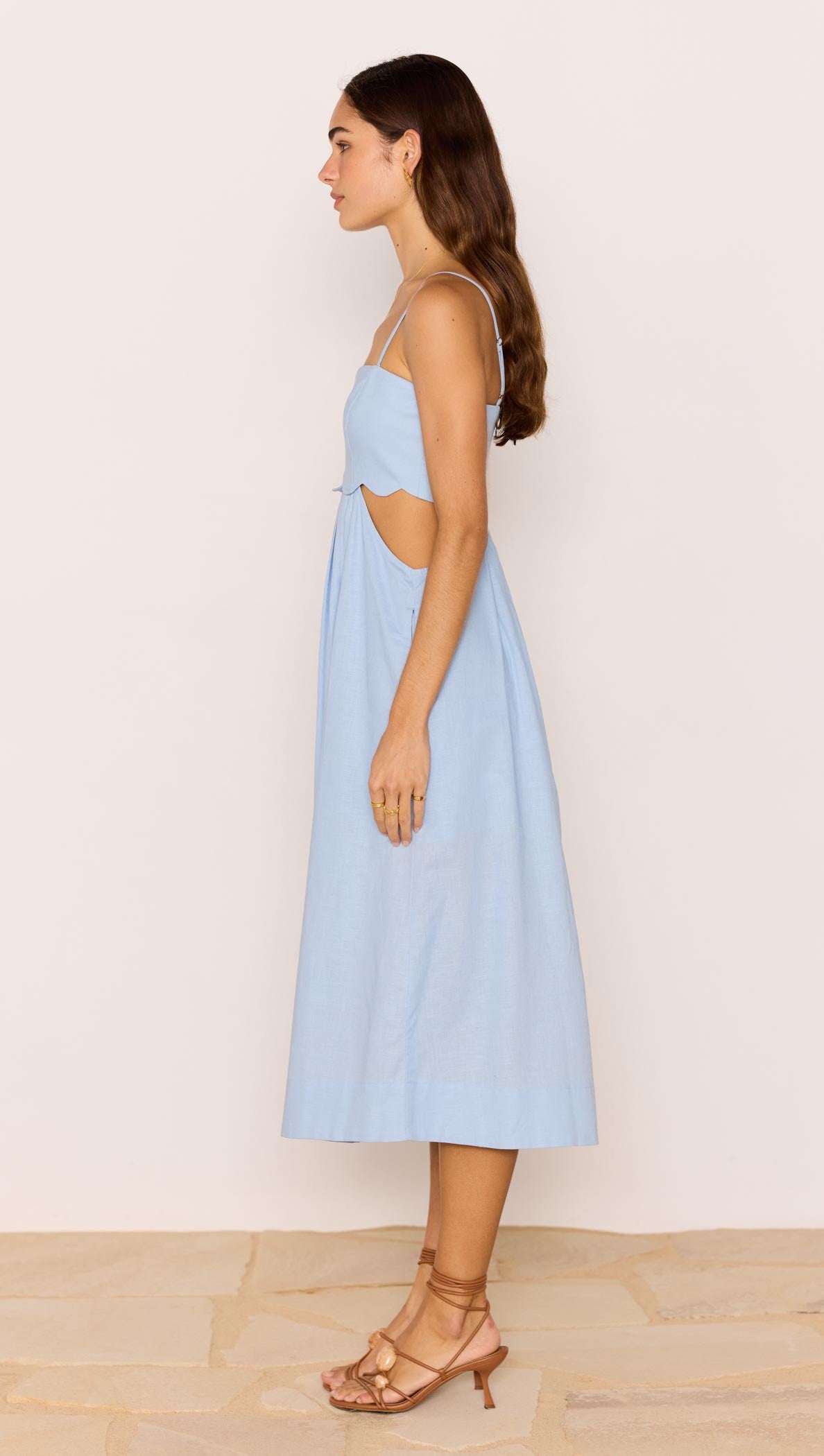 Cotton Linen Blend Blue Cut-Out Midi Dress featuring a side view showcasing its fitted bodice and subtle cut-out sides.