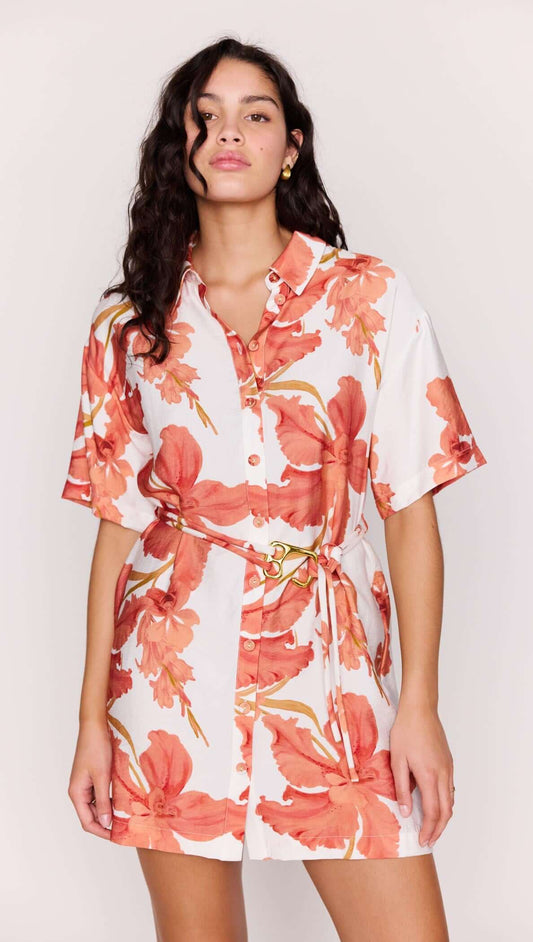 Model showcasing the Peach Hibiscus Mini Shirt Dress with vibrant floral print and detachable waist tie.