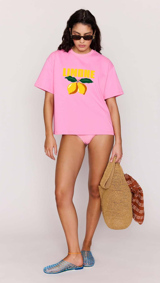 Model wearing Pink Citrus Print Relaxed Oversized Cotton Tee with lemon graphic for a vibrant summer look.