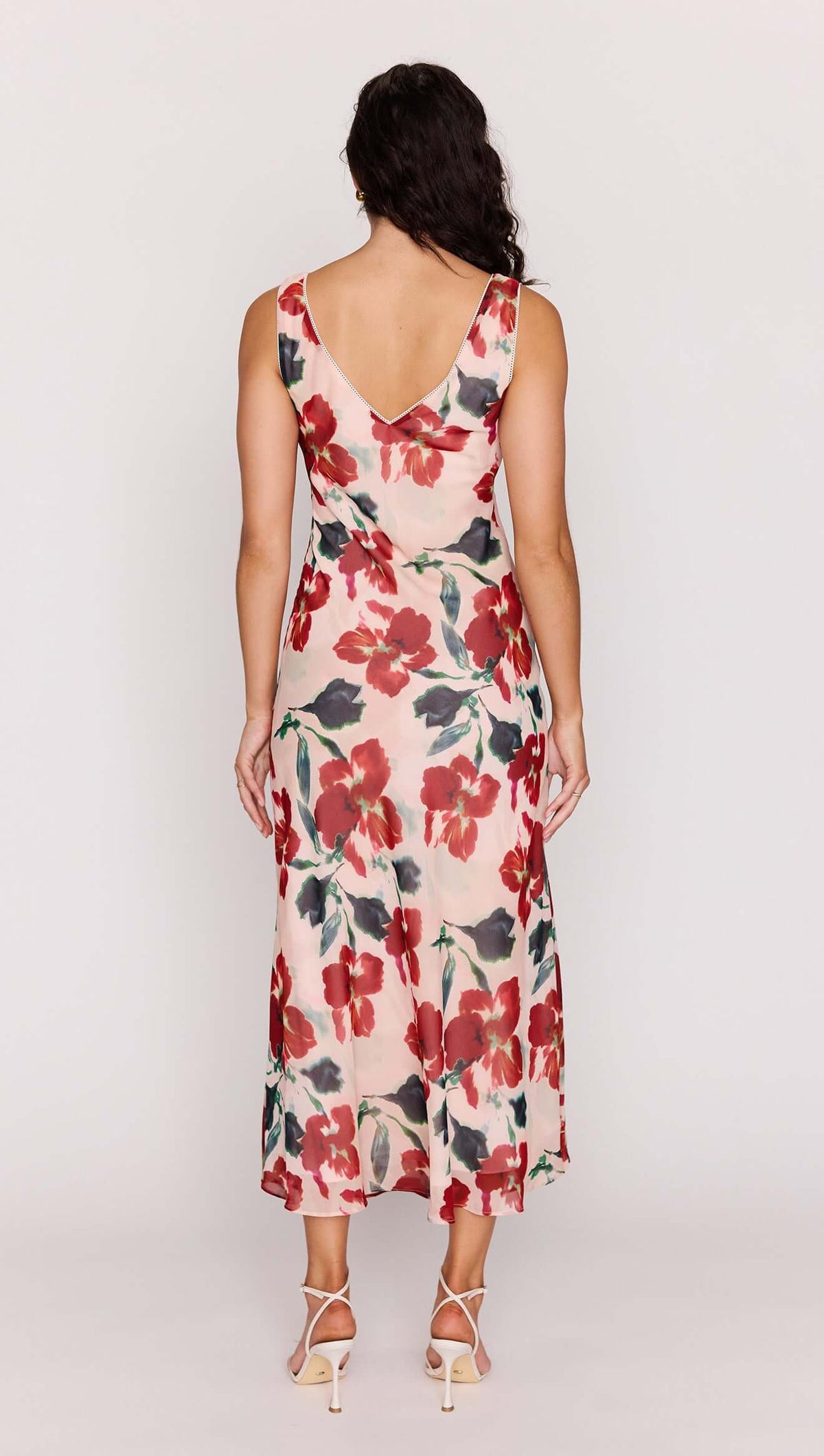 Back view of the Arabella Pink Floral Bias Midi Dress showcasing its floral print and deep V-neckline.